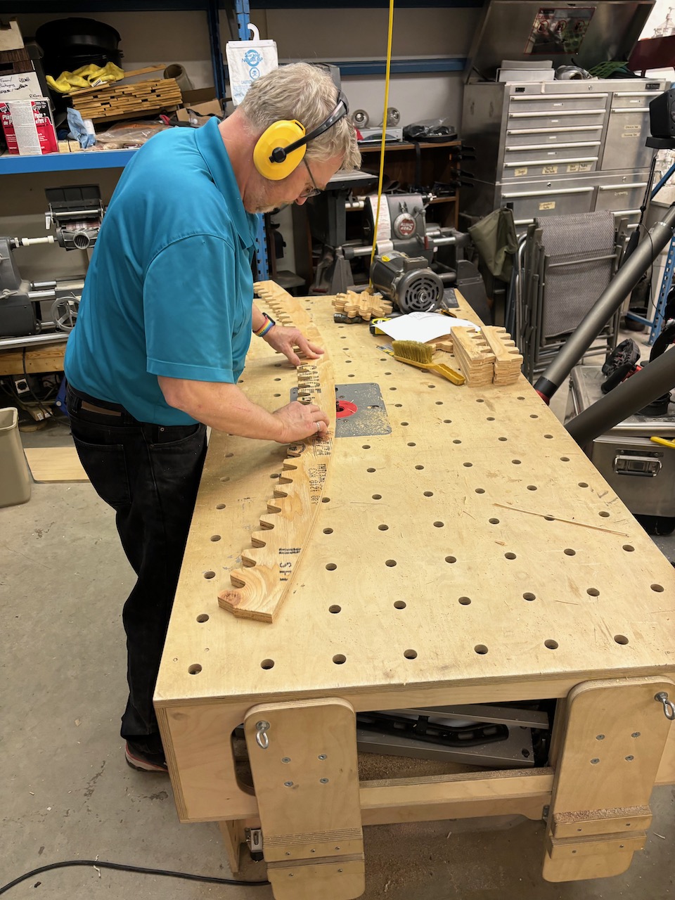 The mastermind Klaus finish trimming at the router table.